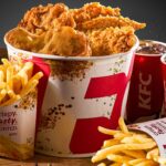 A bucket of KFC greasy fast food meal